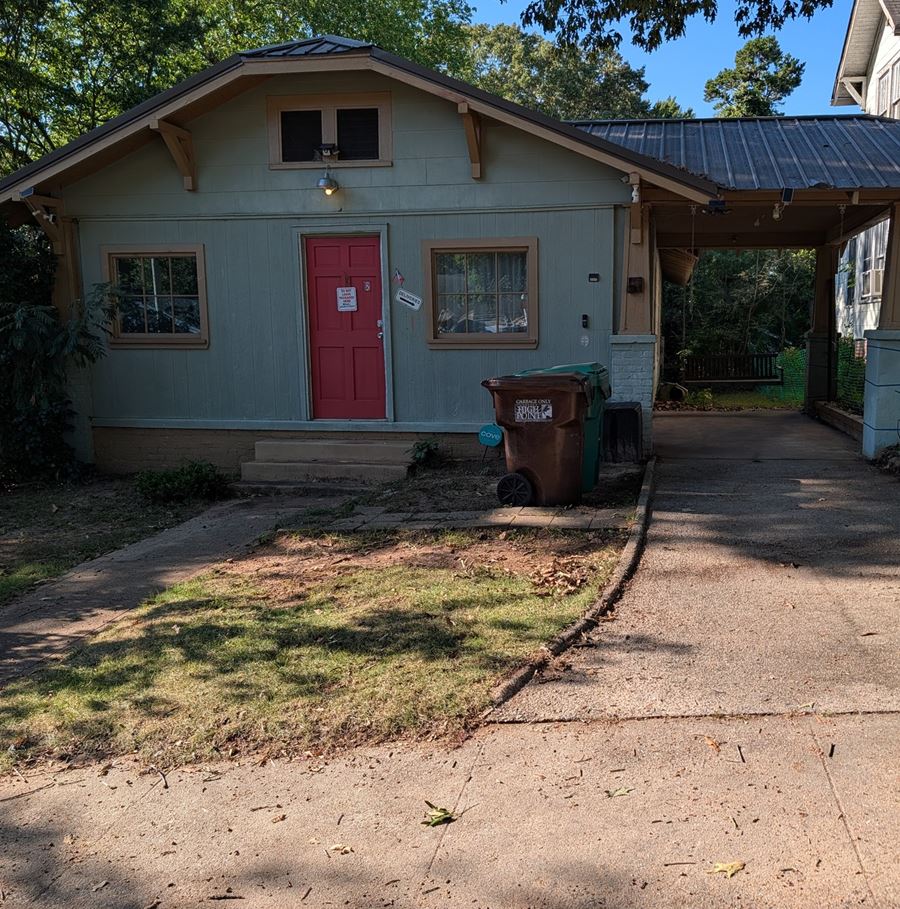 After: the same driveway cleared, swept, and empty